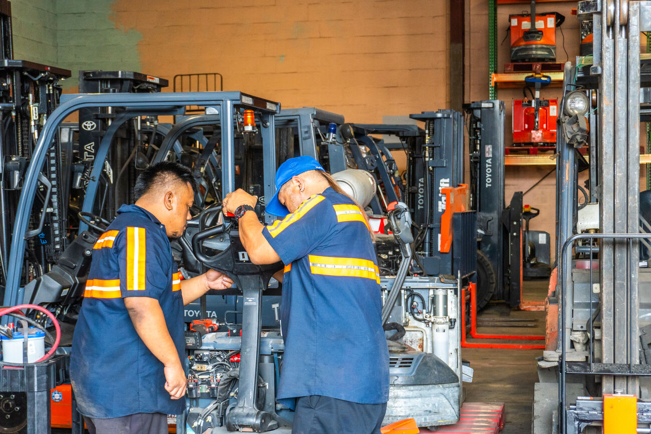 Service technicians repairing a Toyota Forklift; Maintenance Plan 